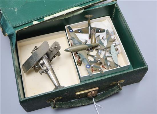 A collection of painted lead medals of World War II RAF aeroplanes, a model bi-plane and two model bombs marked For Hitler